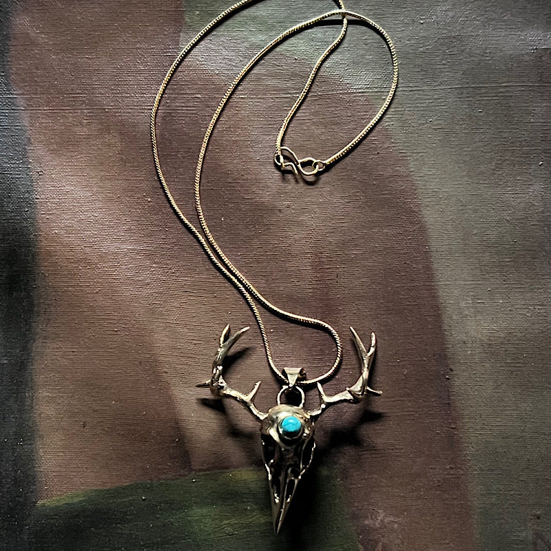 Brass Crystal Cryptid Necklace with Howlite